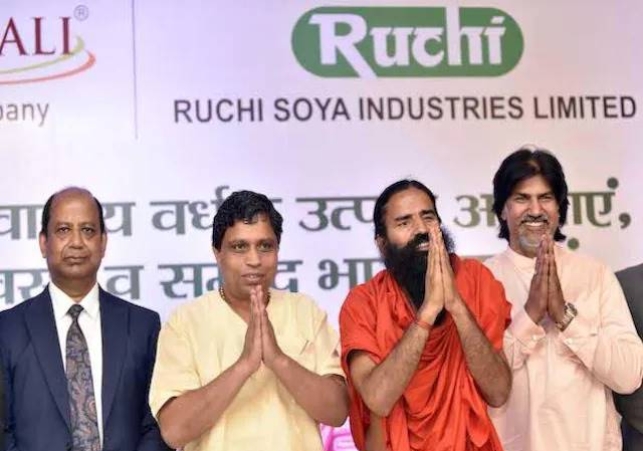 (L to R) Sanjeev Kumar Asthana, ECO, Ruchi Soya Industries Ltd, Acharya Balakrishna, Chairman, Ramdev, Non-Executive Director and Ram Bharat, MD during a press conference in Mumbai (Photo: Kamlesh Ped